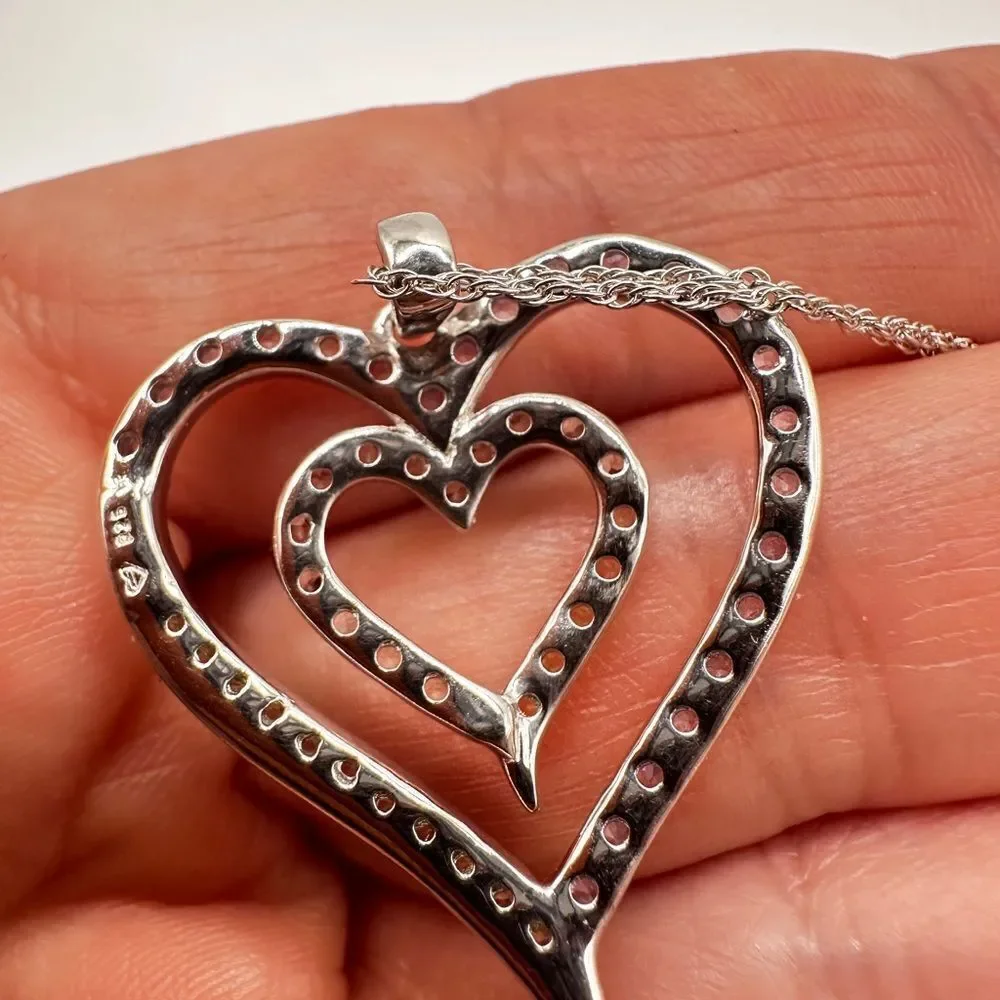 Genuine 1.5ctw tanzanite and‎ CZ accent heart necklace in sterling silver!